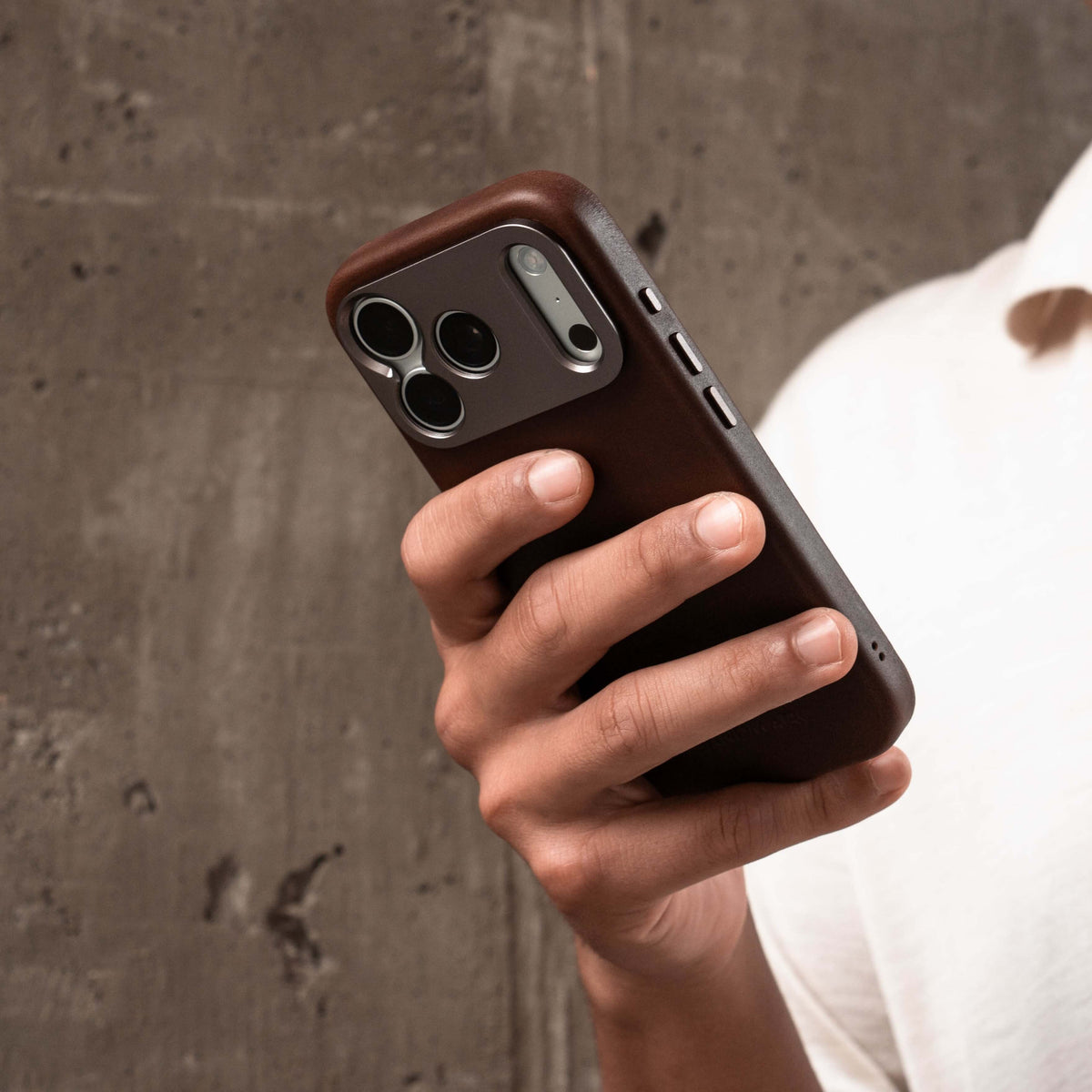 iPhone brown leather case in concrete background - image 3