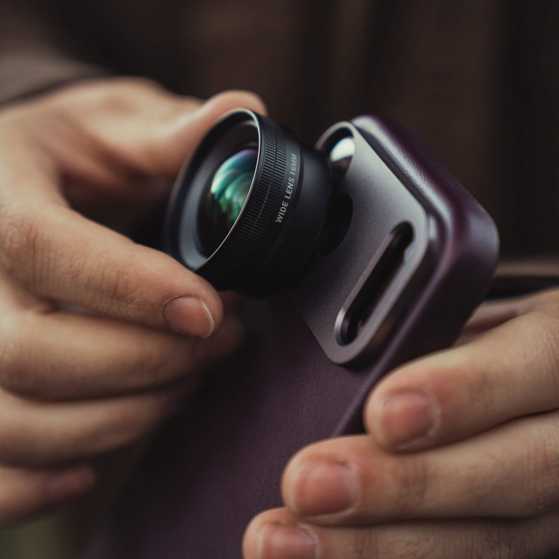 SANDMARC Wide Lens attached to the Pro Leather Burgundy case on the iPhone 18 Pro 